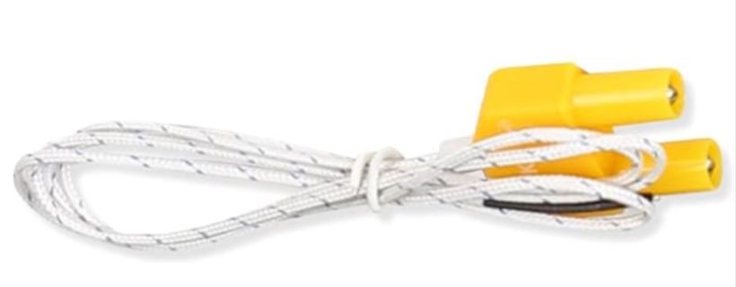 Gelbe Krokodilklemmen mit weißem Kabel