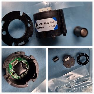 Zerlegte Elektronikkomponente mit Platine und Gehäuseteilen