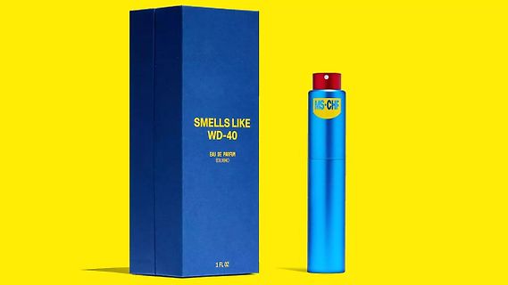 Parfümflasche und Verpackung mit WD-40 Aufschrift