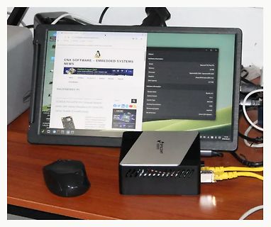 Abfotografierter Monitor mit Systeminformationen und Raspberry Pi Hardware