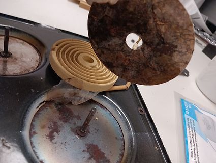 Defekte Elektroherdplatte und Heizspirale