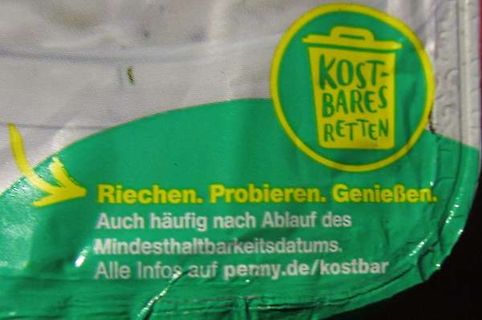 Werbeaufkleber mit Text auf grünem Hintergrund