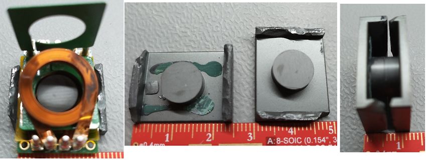 Nahaufnahme von Bauteilen und Metallgehäusen mit Lineal