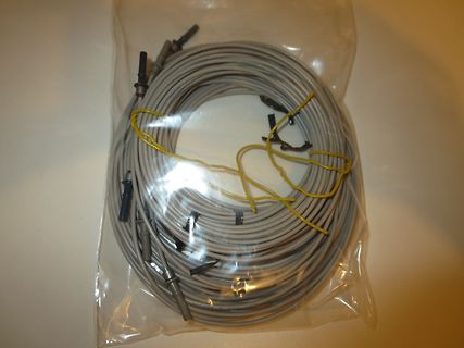Aufgerollte Messleitungen in Plastikverpackung