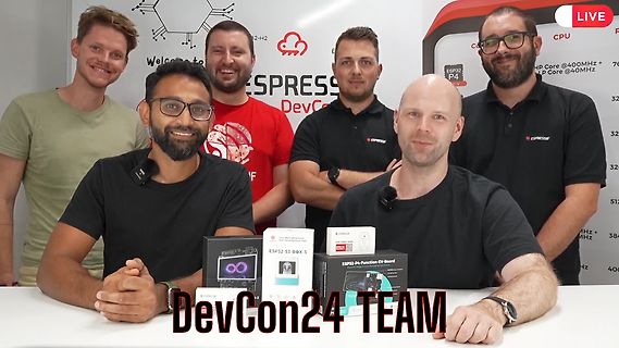 Sechs Männer des DevCon24 Teams vor Espressif Produkten