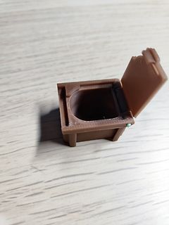Miniatur-Toilette aus braunem Kunststoff