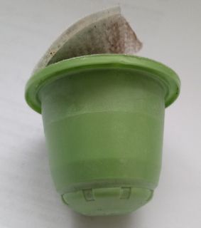 grüne Kaffeekapsel mit Aludeckel