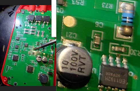 Nahaufnahme einer grünen Leiterplatte mit elektronischen Bauteilen