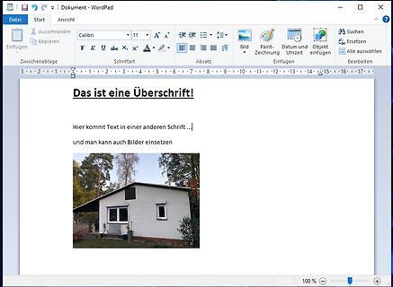 WordPad Dokument mit Text und Foto eines Hauses