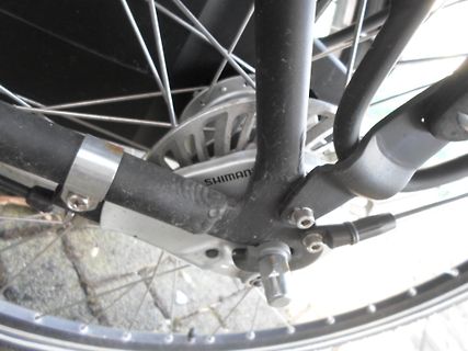 Detailaufnahme einer Fahrrad Bremsscheibe und Bremszange
