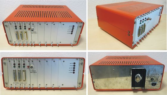 Vier Ansichten eines orangefarbenen Elektronikgehäuses mit Anschlüssen