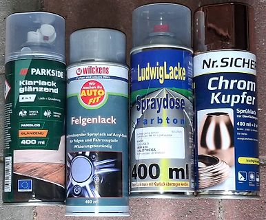 Vier Sprühdosen Lack