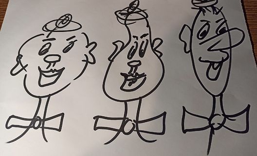 Drei gezeichnete Comic-Gesichter