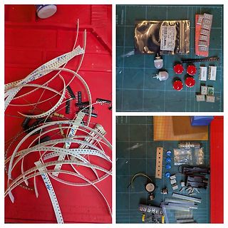 Elektronikbauteile, LED-Streifen und Komponenten auf Werkstattunterlage