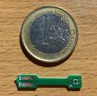 Ein Euro-Stück und eine kleine Leiterplatte
