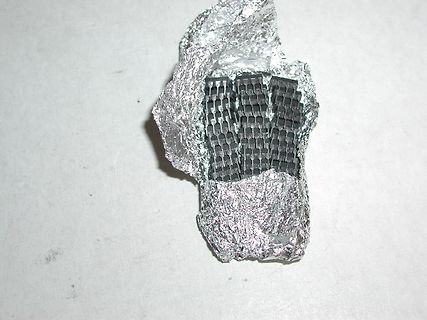 Bauteil in Alufolie eingewickelt