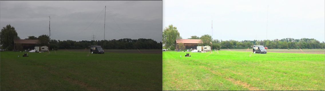 Wiese mit Fahrzeugen und Funkantennen